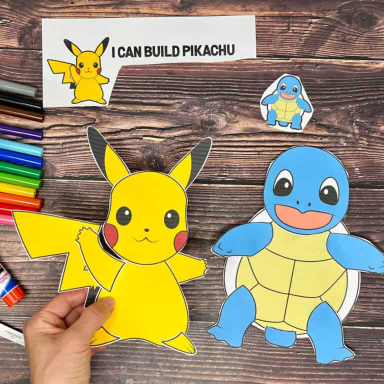 Woman holding Pickachu printable craft and Squirtle craft to feature this free printable set of Pokemon crafts.