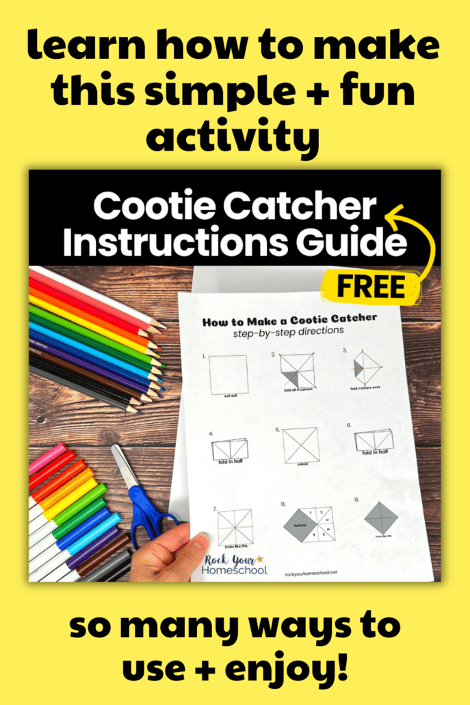 Woman holding free printable cootie catcher instructions guide with color pencils and markers in background.