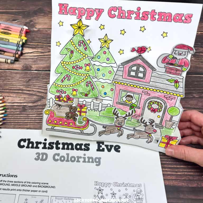 Woman holding example of free printable 3D paper Christmas craft for kids with template for the cute Happy Christmas scene.