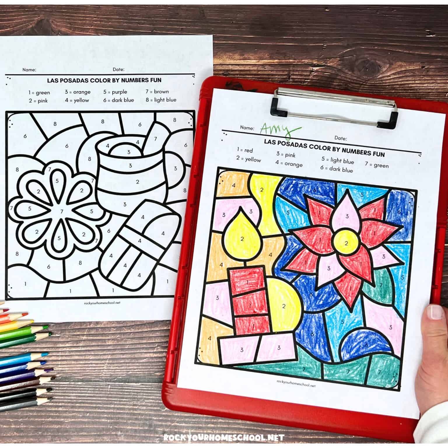 Woman holding clipboard with free printable Las Posadas color by number pages.
