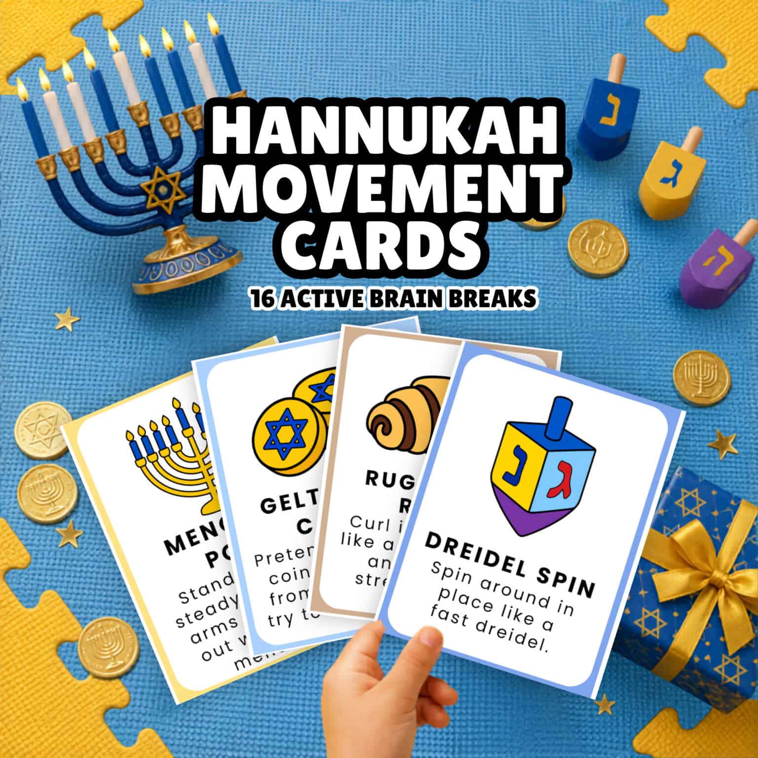 A child's hand holding Hanukkah movement cards for kids.