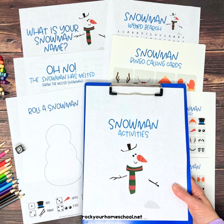 Woman holding blue clipboard with snowman activities featuring word search, bingo, and more.