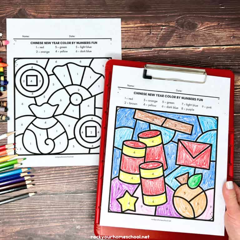 Woman holding red clipboard with Chinese New Year color by number pages and color pencils.