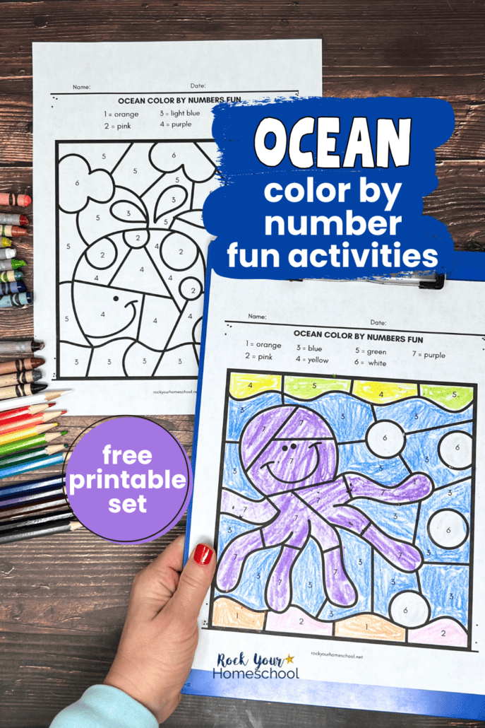 Woman holding blue clipboard with examples of ocean color by number worksheets featuring octopus and whale.