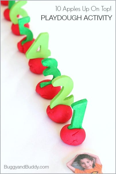 Red balls of playdough with green foam numbers for activity for Ten Apples Up On Top! by Dr. Seuss.