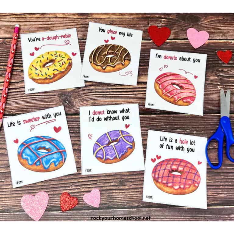 6 free printable donut Valentine's Day cards with pink and red glitter hearts.