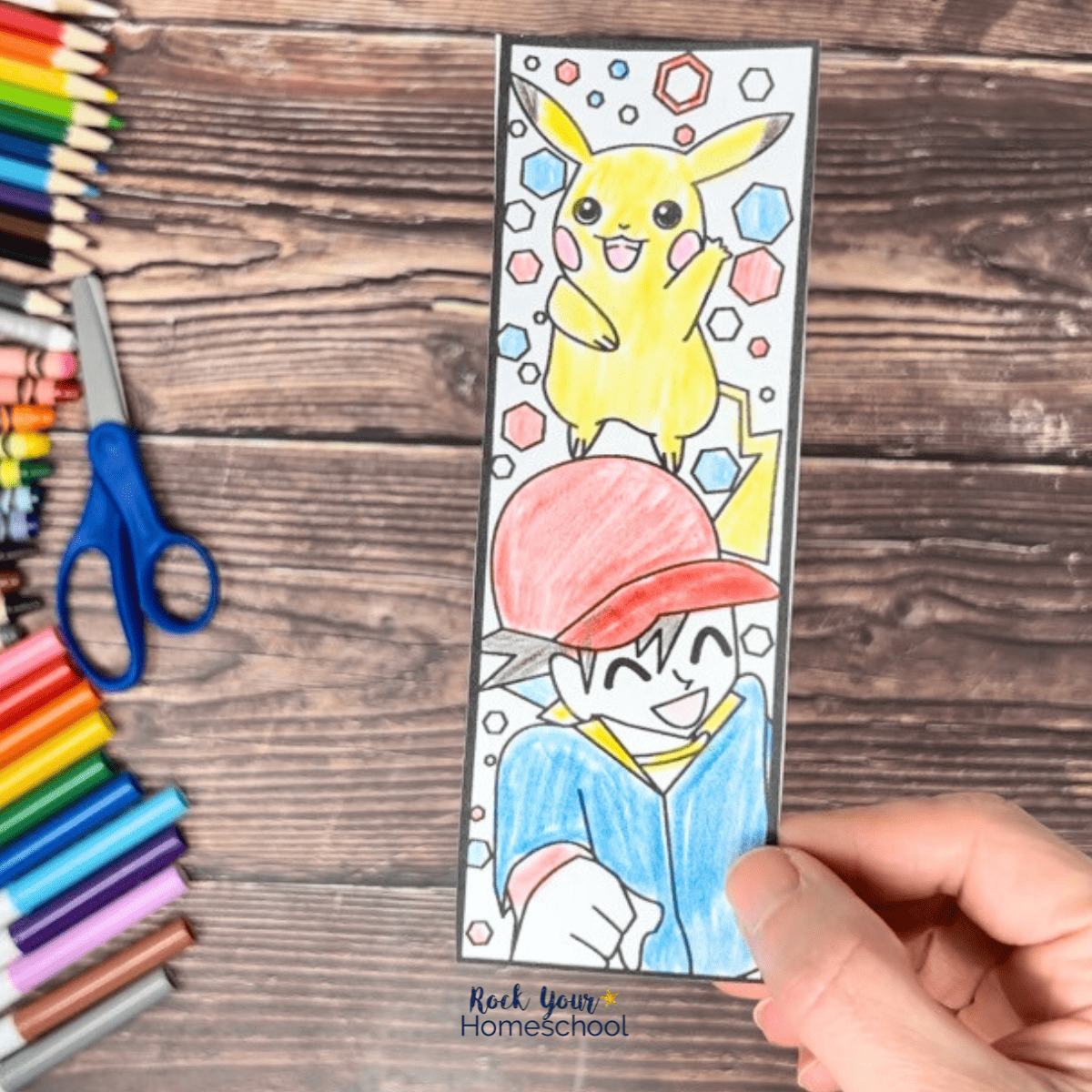 Woman holding Pikachu and Ash bookmarks as example of this free set of printable coloring bookmarks.
