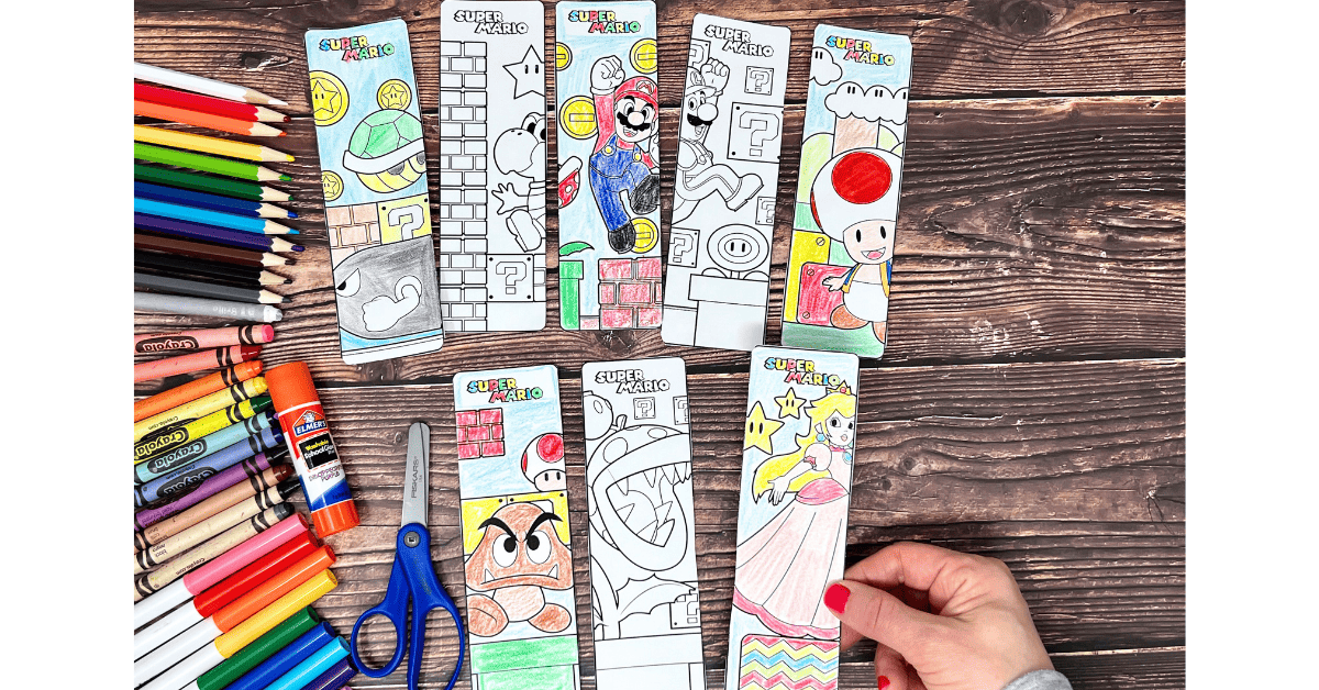 Woman holding examples of Super Mario coloring bookmarks.