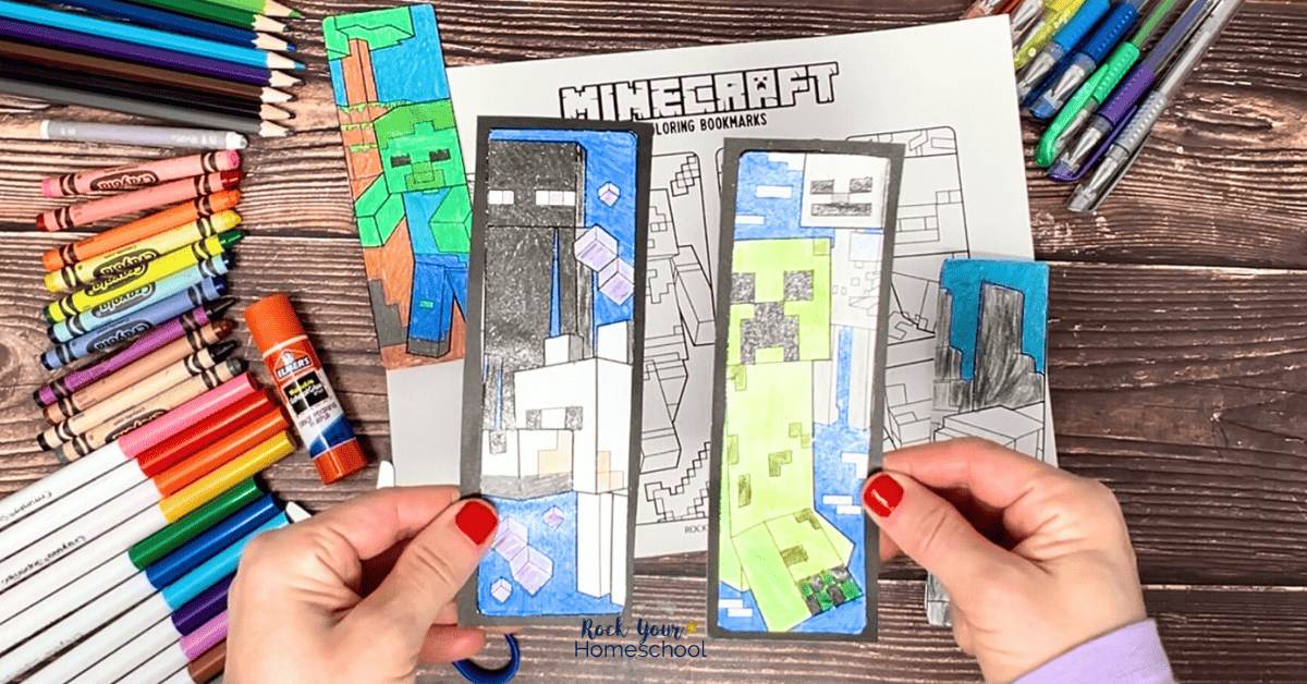 Woman holding two examples of Minecraft bookmarks to color with black cardstock borders.