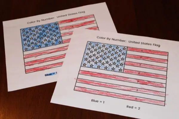 Two examples of free printable color by number American flag worksheets.