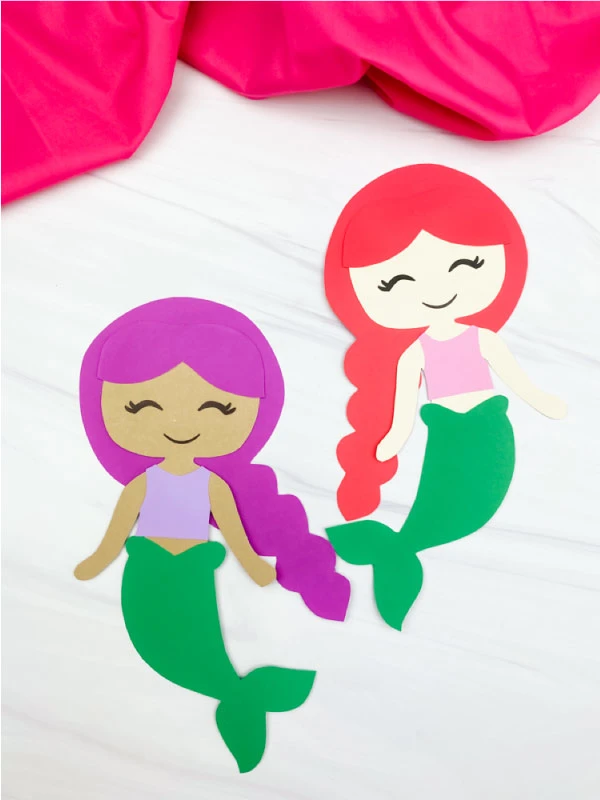 Two examples of mermaid paper craft for kids.