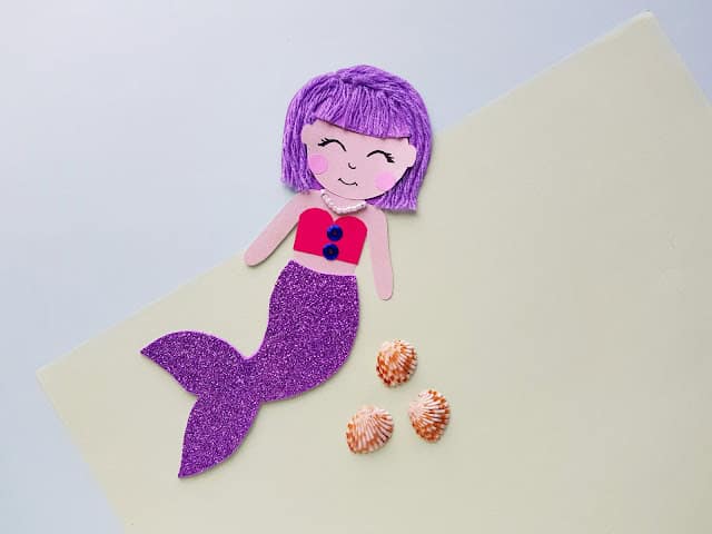 Example of mixed media mermaid doll craft with shells.