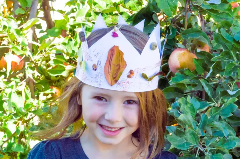 Girl wearing nature crown craft.