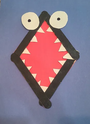 Example of popsicle stick shark mouth craft.