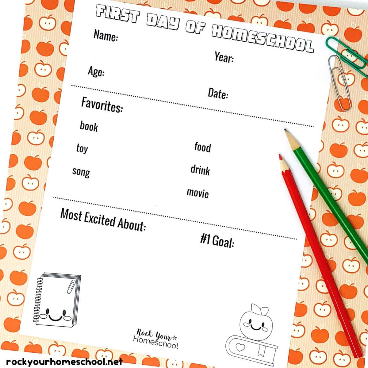 Example of first day of homeschool printable worksheets with paperclips, red and green color pencils, and apple-themed paper.
