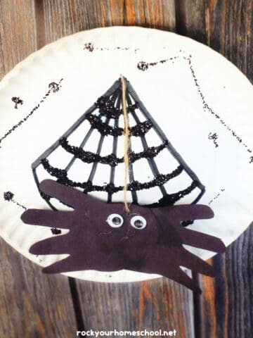 Example of handprint spider craft with paper plate web.