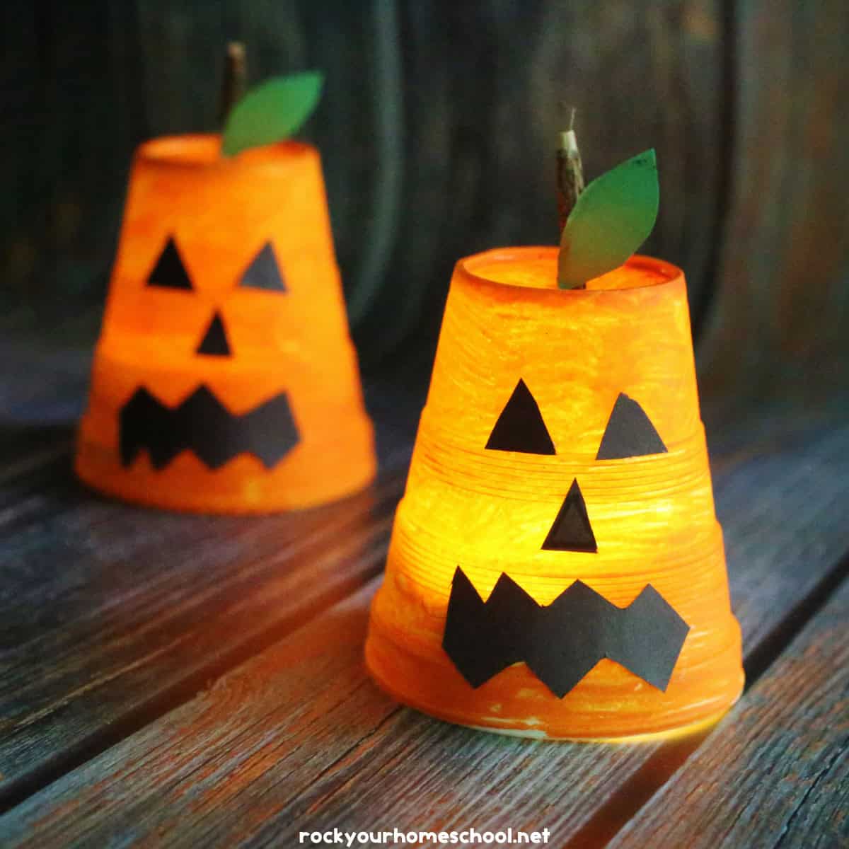 2 light up jack o lantern crafts using cups and flameless tealights.