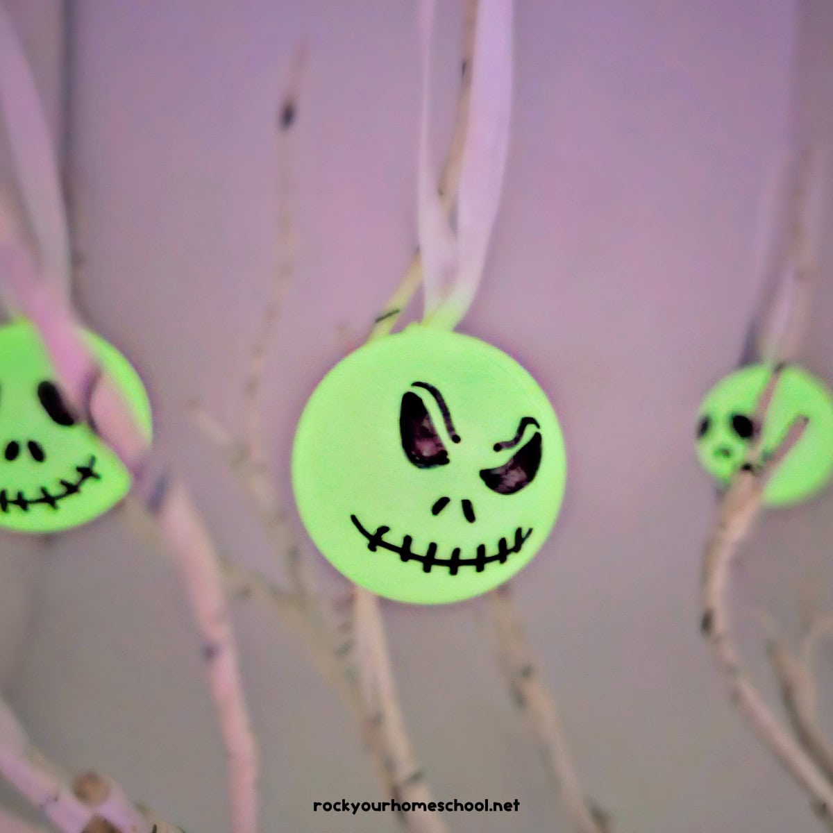 Three examples of DIY Jack Skellington ornaments.