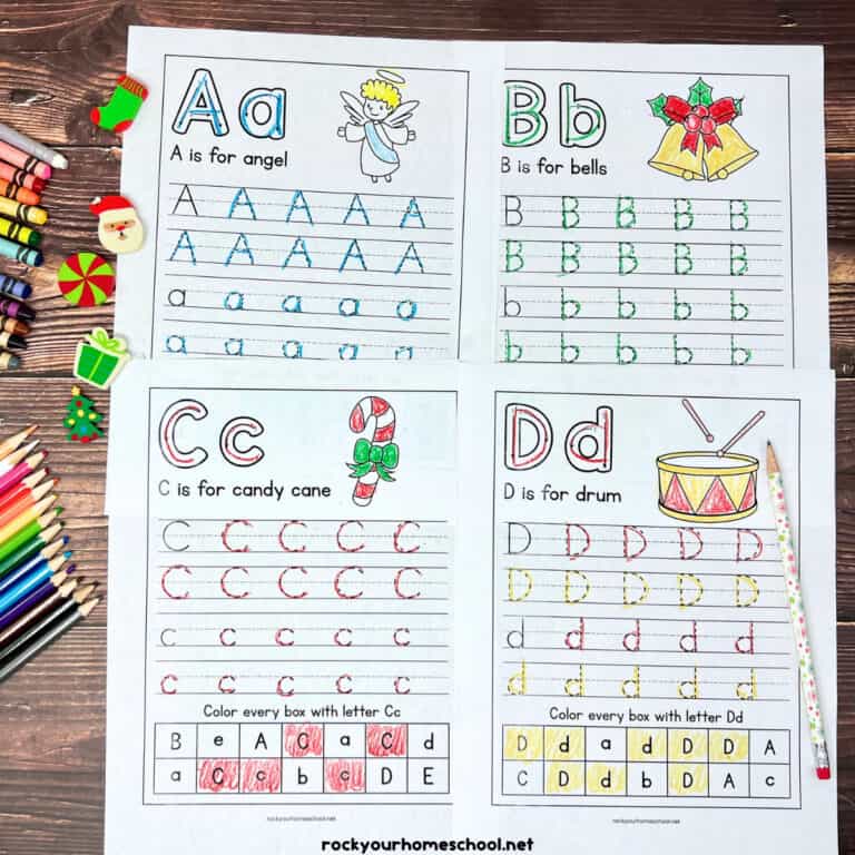 Four printable Christmas handwriting worksheets featuring the letters A, B, C, and D with mini erasers, crayons, and color pencils.