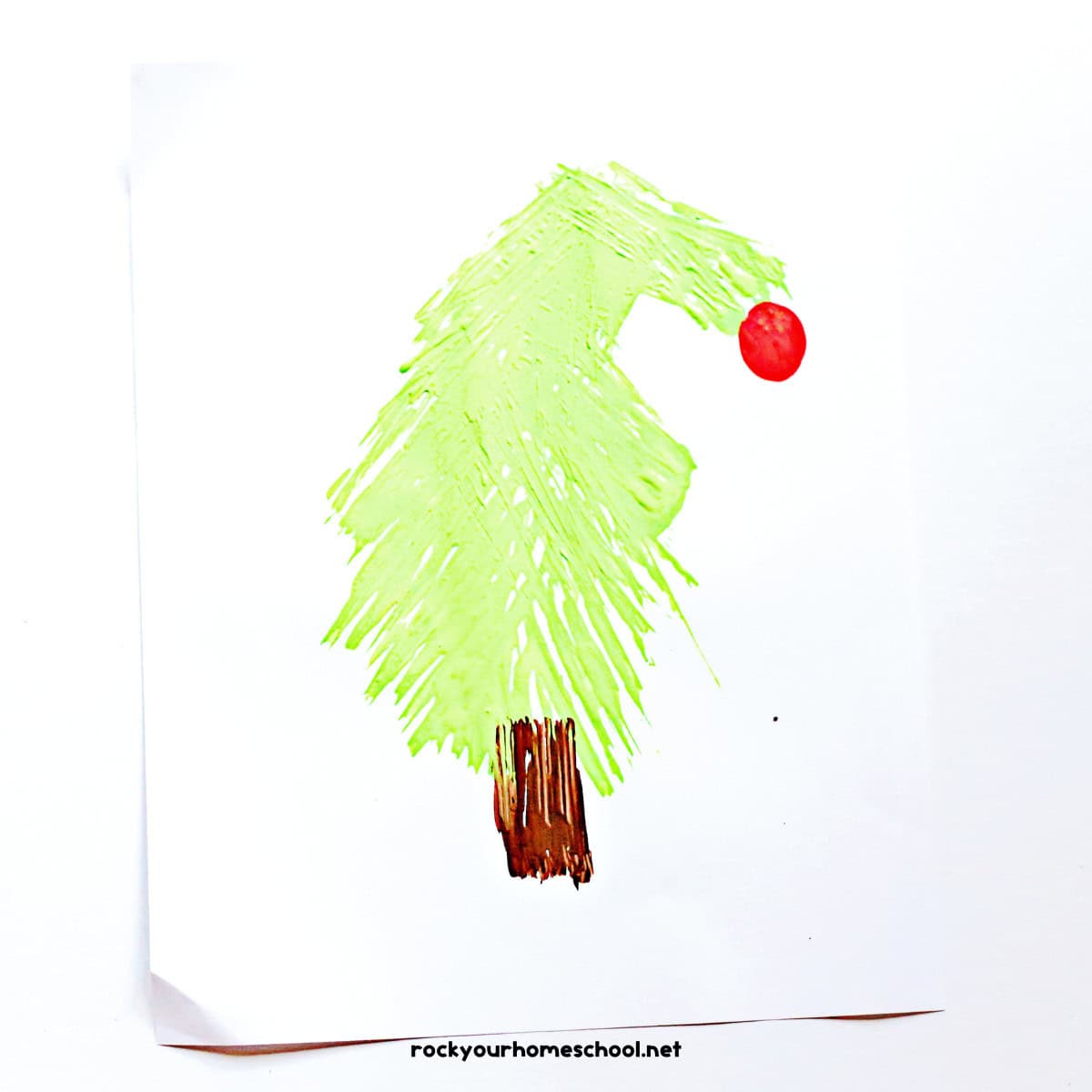 Example of easy Grinch craft featuring a fork painted tree.