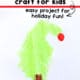 Example of easy Grinch craft featuring a crooked Christmas tree made by fork painting.