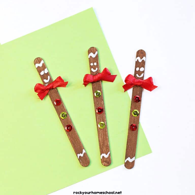 3 examples of easy gingerbread man crafts made with popsicle sticks, paint, ribbons, and sequins.