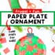 Red and green tissue paper, black construction paper, scissors, glue stick, red pipe cleaner, and paper plate with example of paper plate ornament craft.