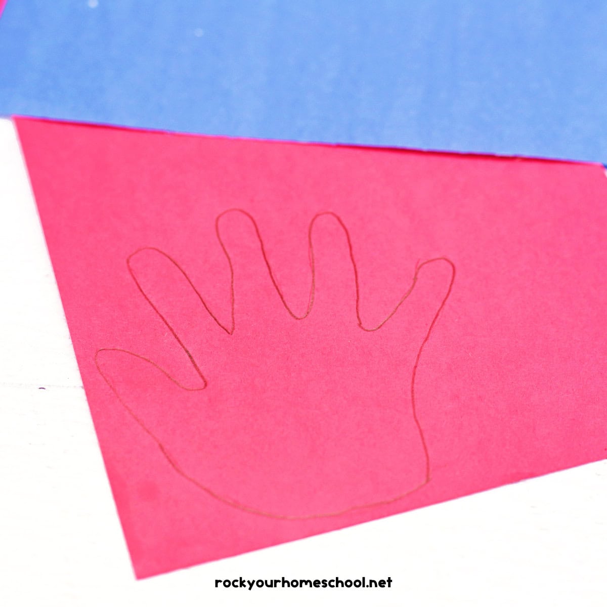 Blue and red construction paper with hand traced.