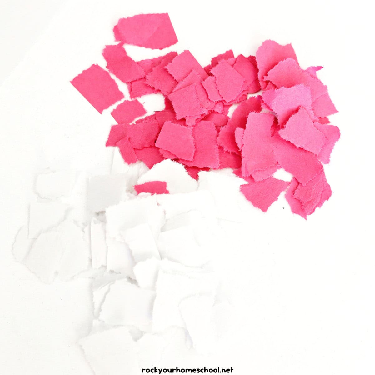 Two piles of red and white torn paper pieces.