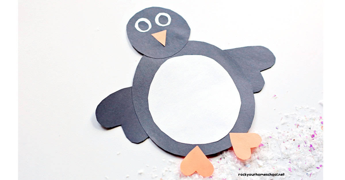 Example of basic shape penguin craft for kids made out of construction paper.