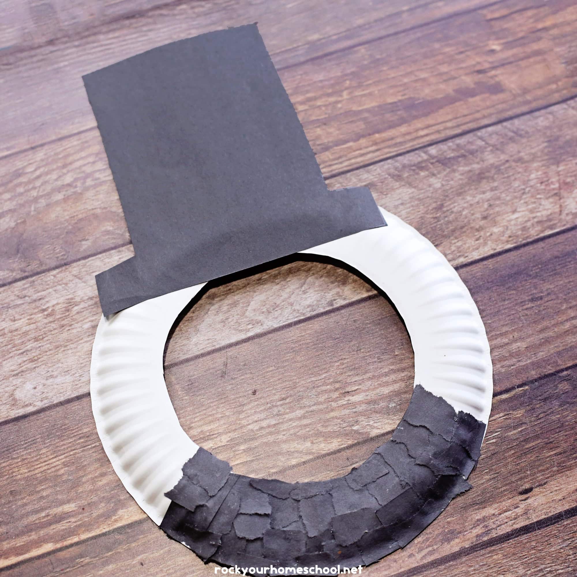 Example of simple Abraham Lincoln paper plate craft for kids to make a fun mask.