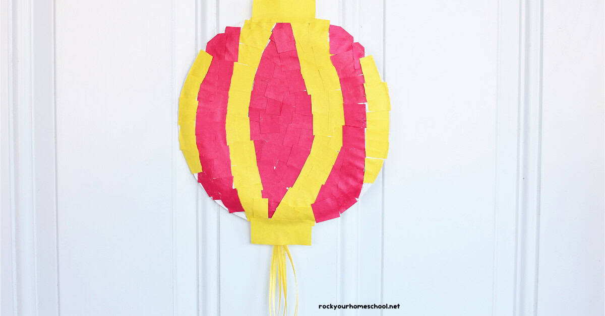 Example of Chinese New Year lantern craft made with paper plate and red and yellow construction paper.