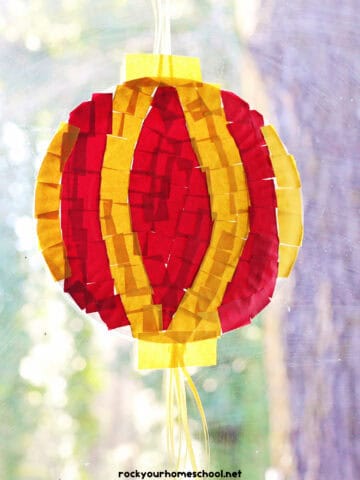 Example of red and yellow paper plate and torn paper Chinese New Year lantern craft.