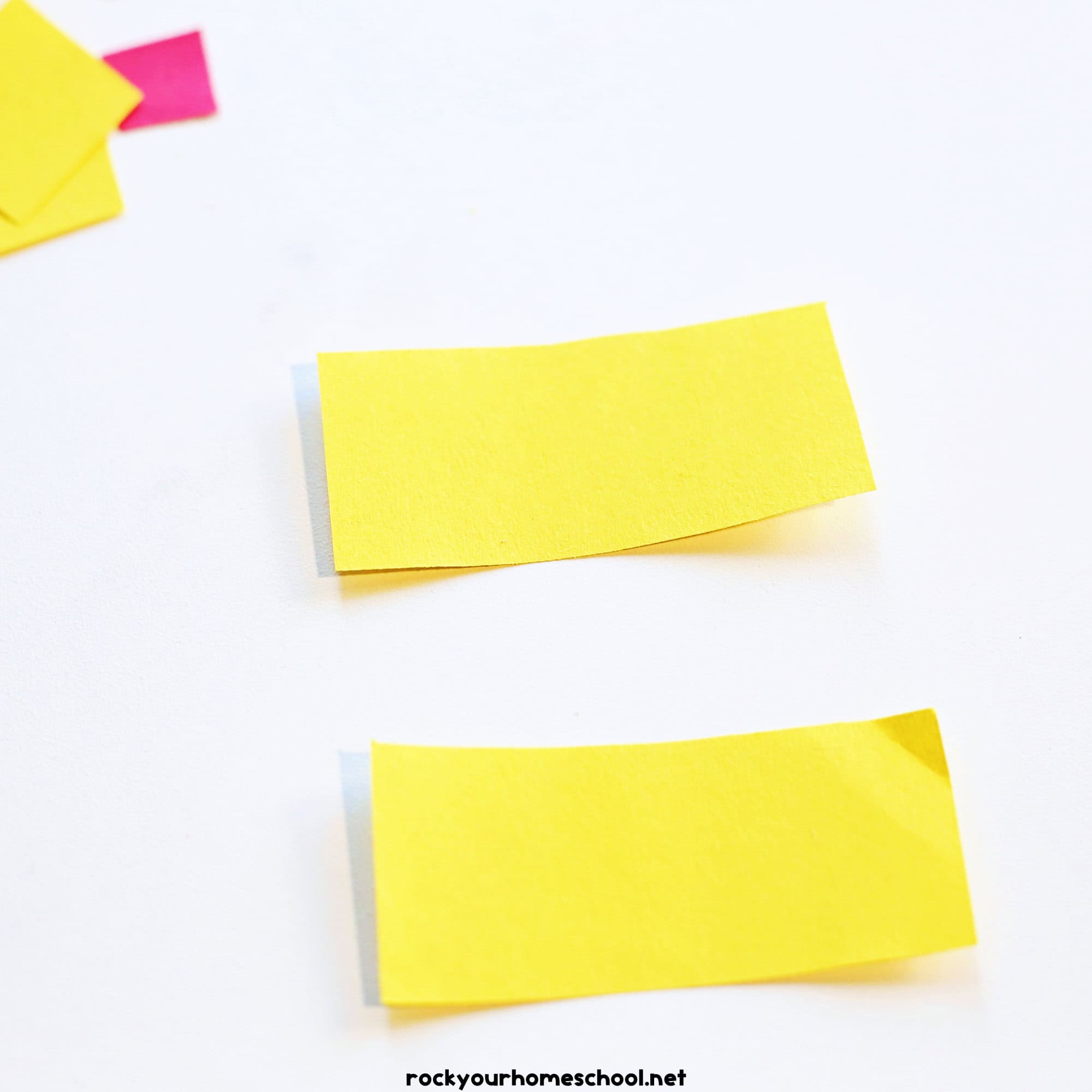 Two yellow paper rectangles.