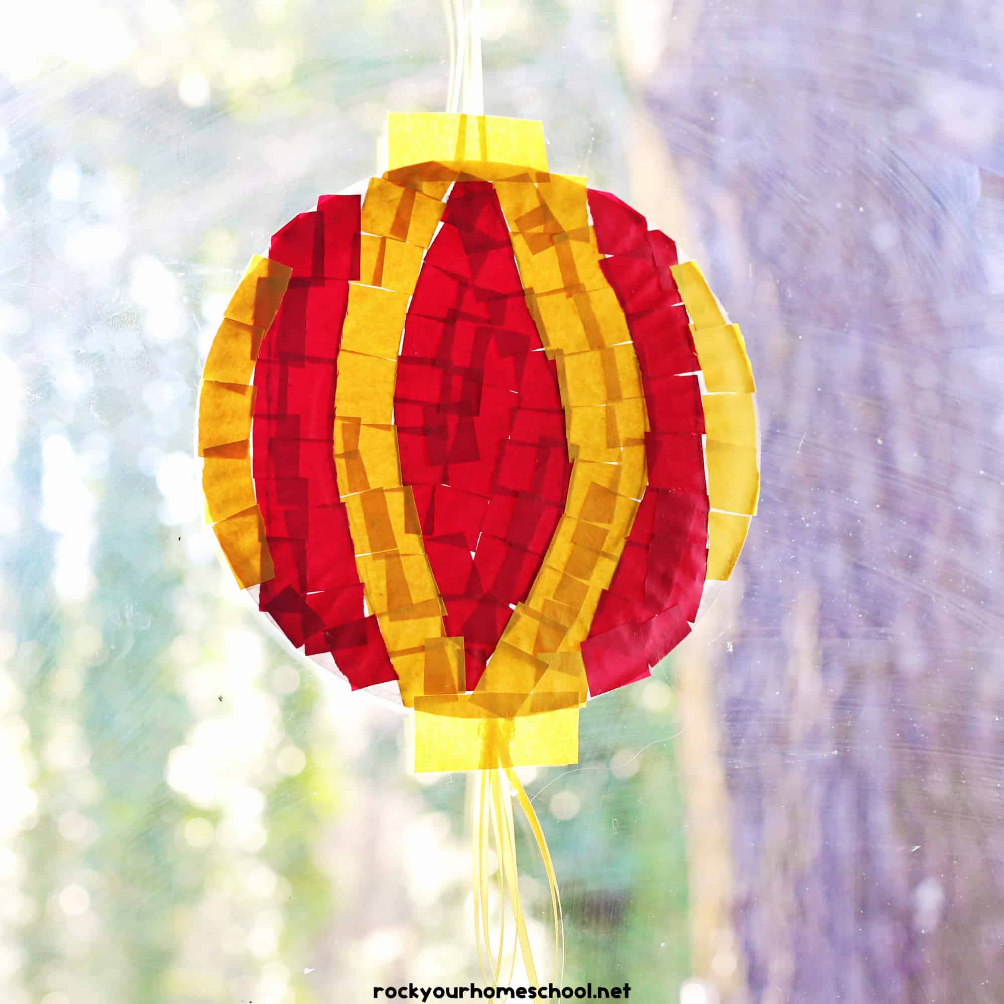 Example of red and yellow paper plate and torn paper Chinese New Year lantern craft.