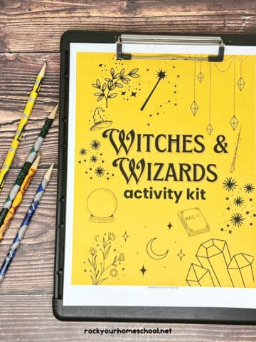 Cover of Witches & Wizards activity sheets in gold and black with pencils to feature these free printable Harry Potter activity sheets set.