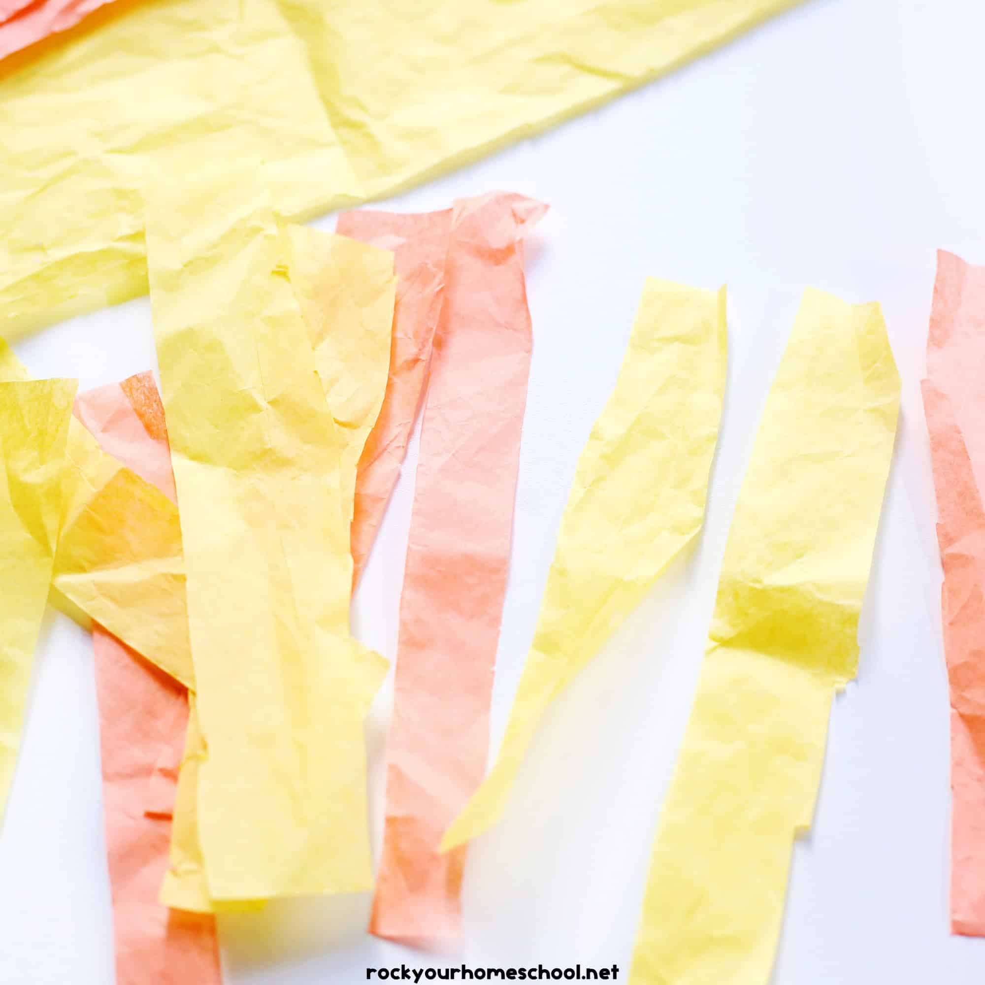 Strips of yellow and orange tissue paper.