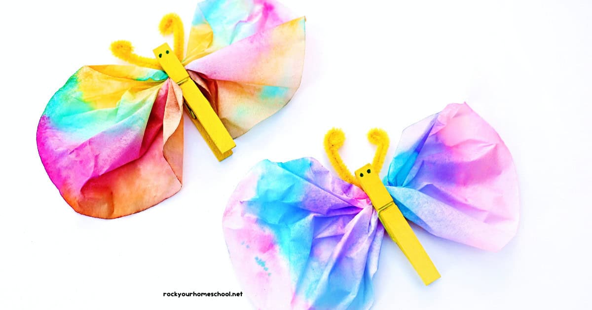 Two examples of coffee filter butterfly crafts with yellow pipe cleaner antenna and clothespin bodies.