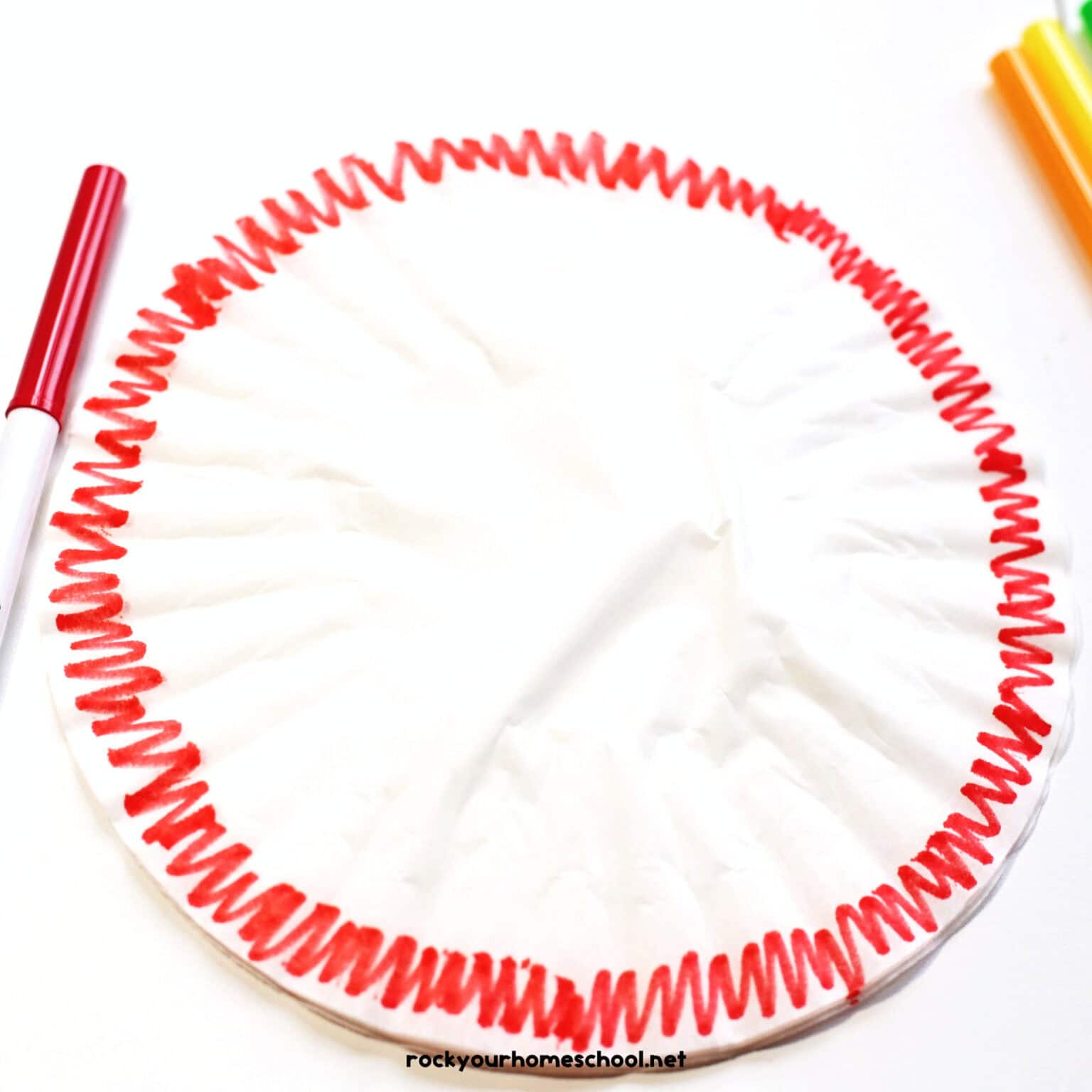 Coffee filter with red marker.