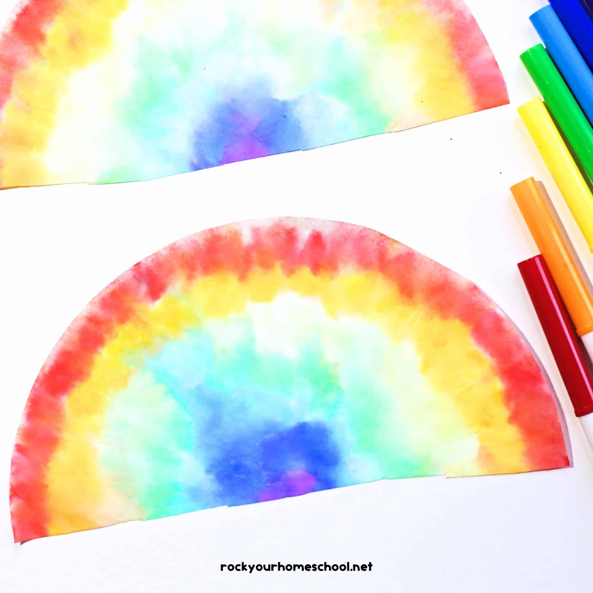 Two examples of coffee filter rainbow crafts with markers.