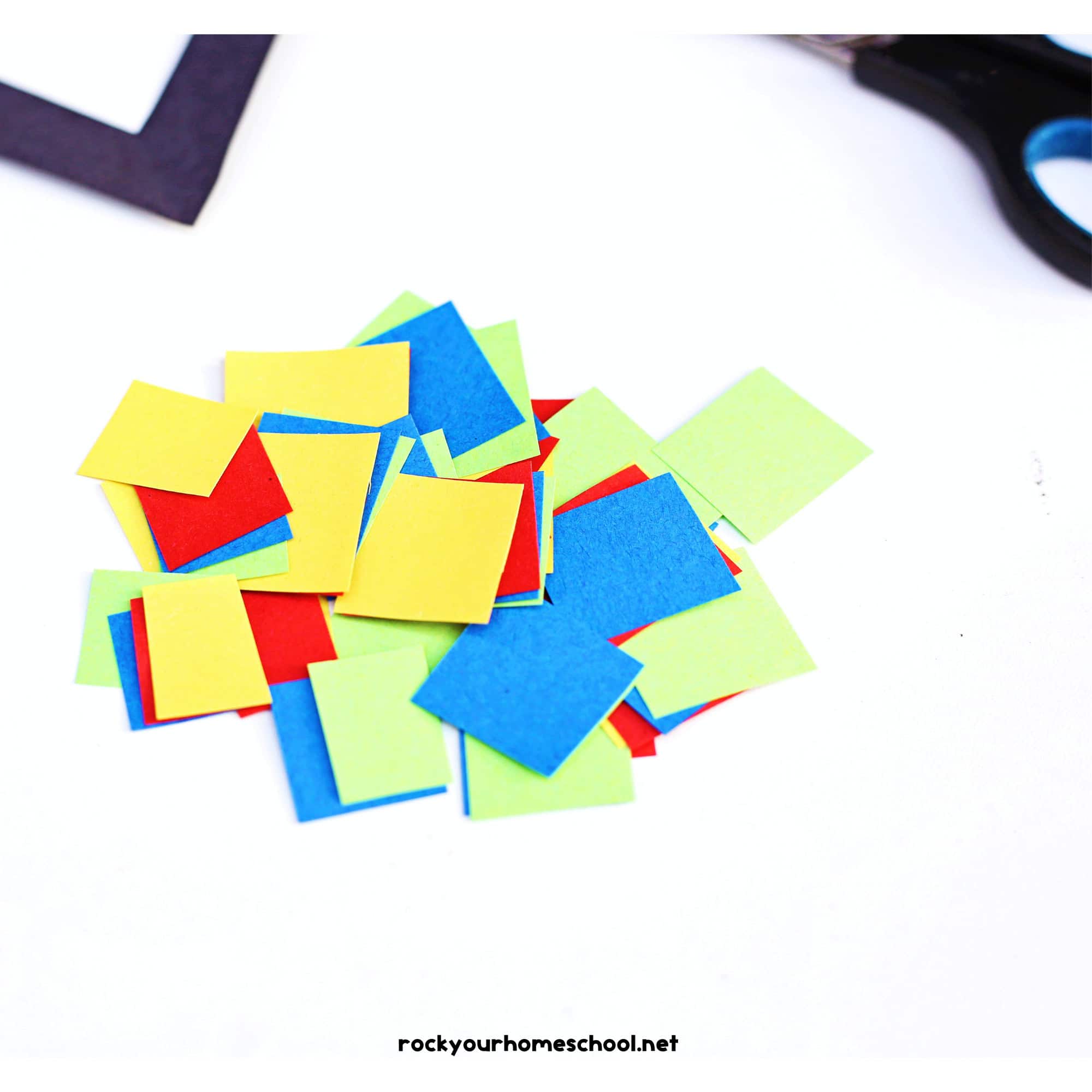 Yellow, blue, red, and green paper squares.