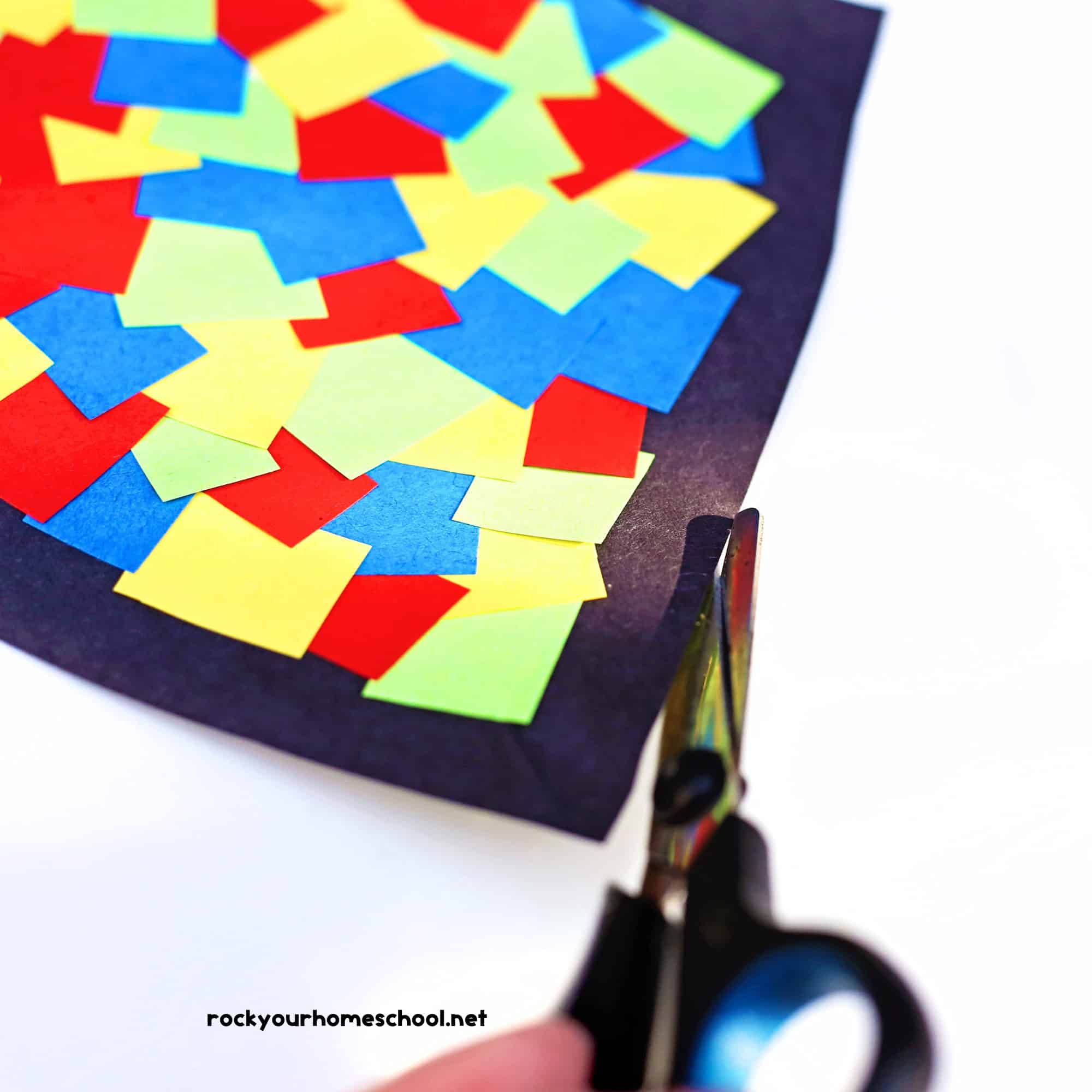 Scissors and kite suncatcher craft.