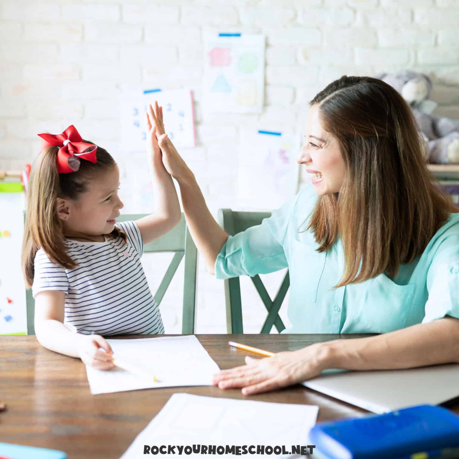Mom high fiving daughter to feature how mistakes = opportunities in your homeschool.