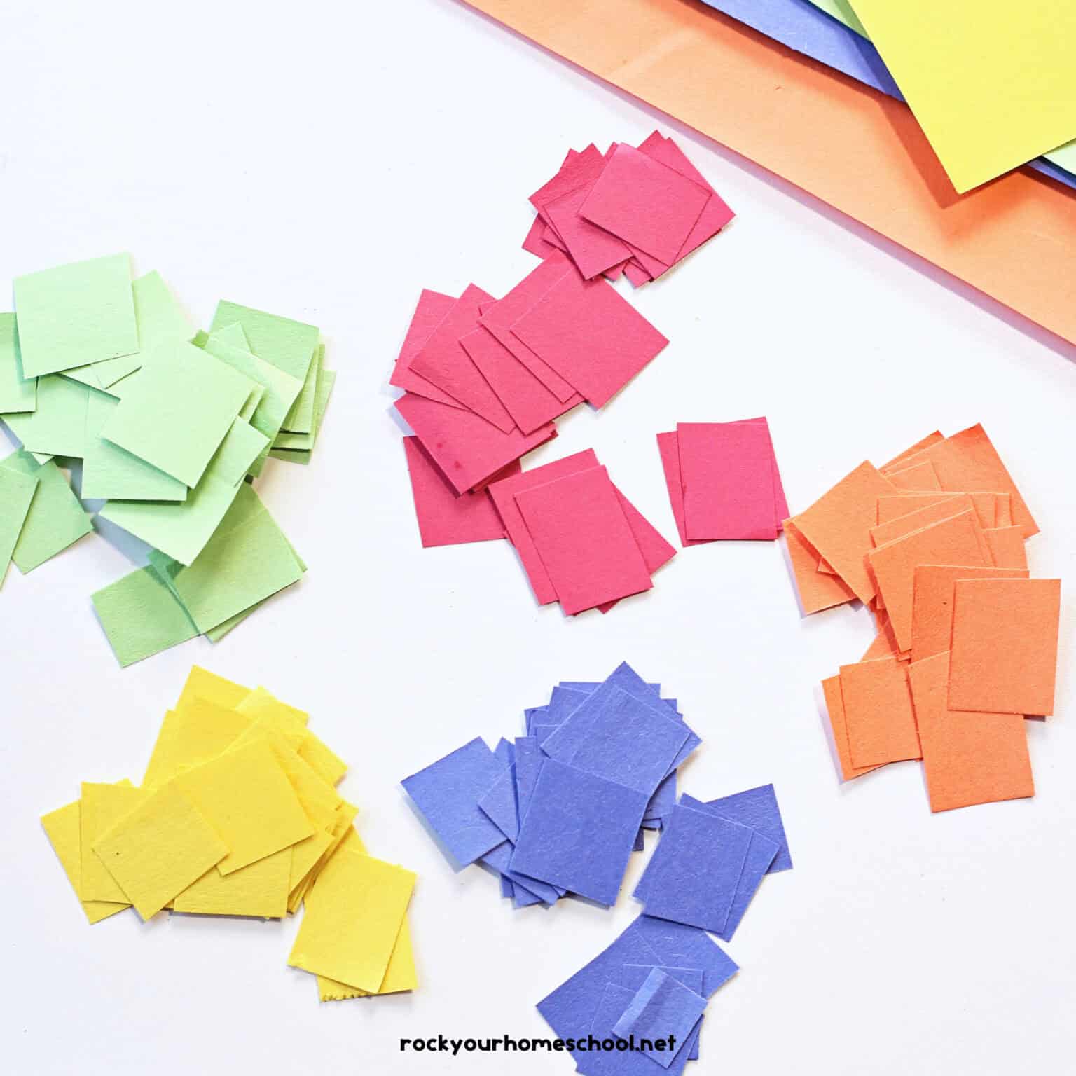 Red, orange, yellow, green, and blue paper squares.