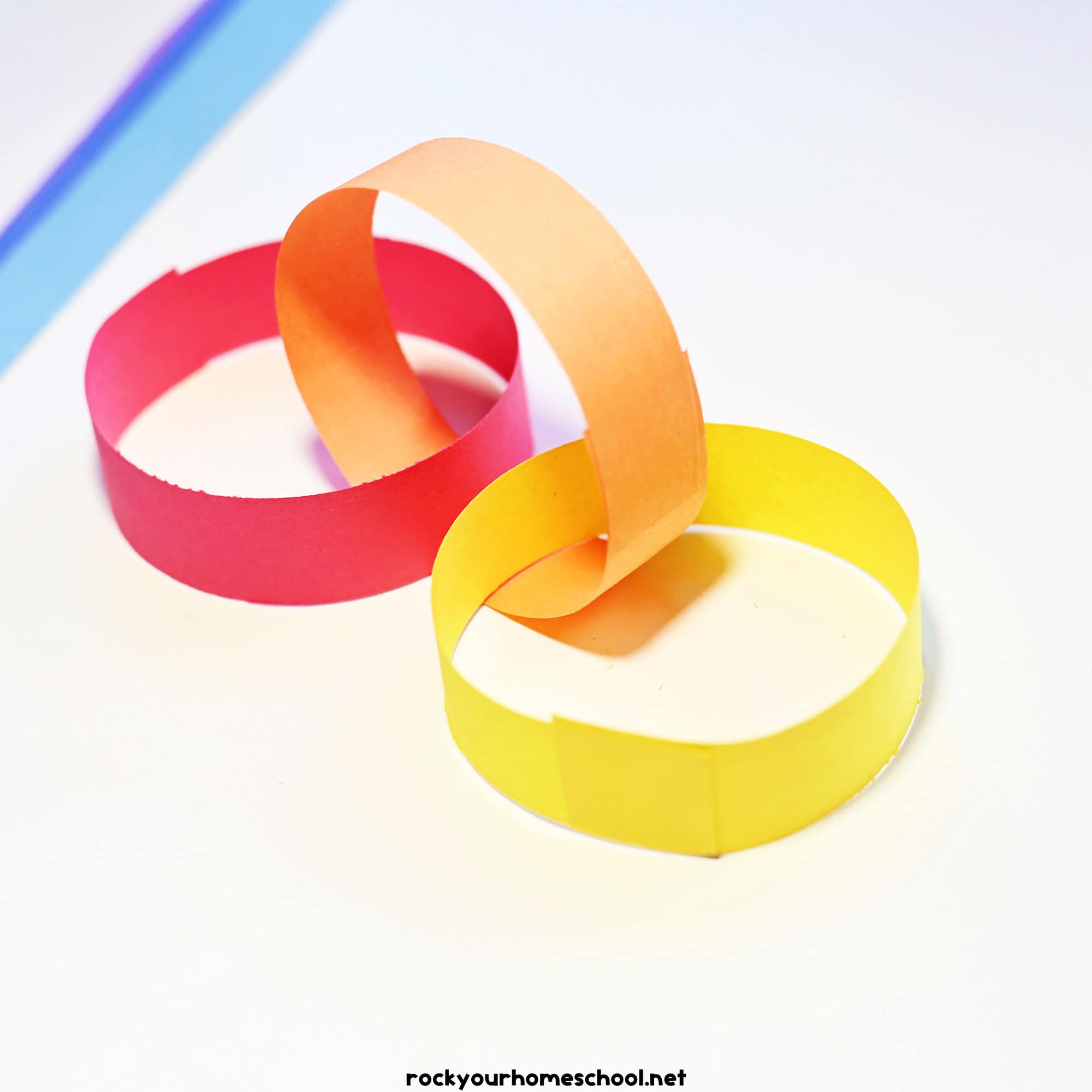 Red, orange, and yellow paper strips as links.