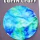 Example of blue and green coffee filter Earth craft on black construction paper.