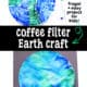 Coffee filter and green and blue markers and example of coffee filter Earth craft on black construction paper.