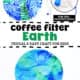 Coffee filter with blue and green markers, blue spray bottle with water and coffee filter Earth craft examples.