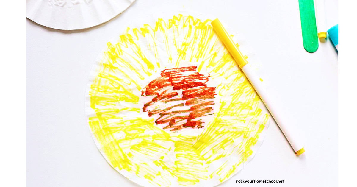 Coffee filter colored yellow and brown with markers.