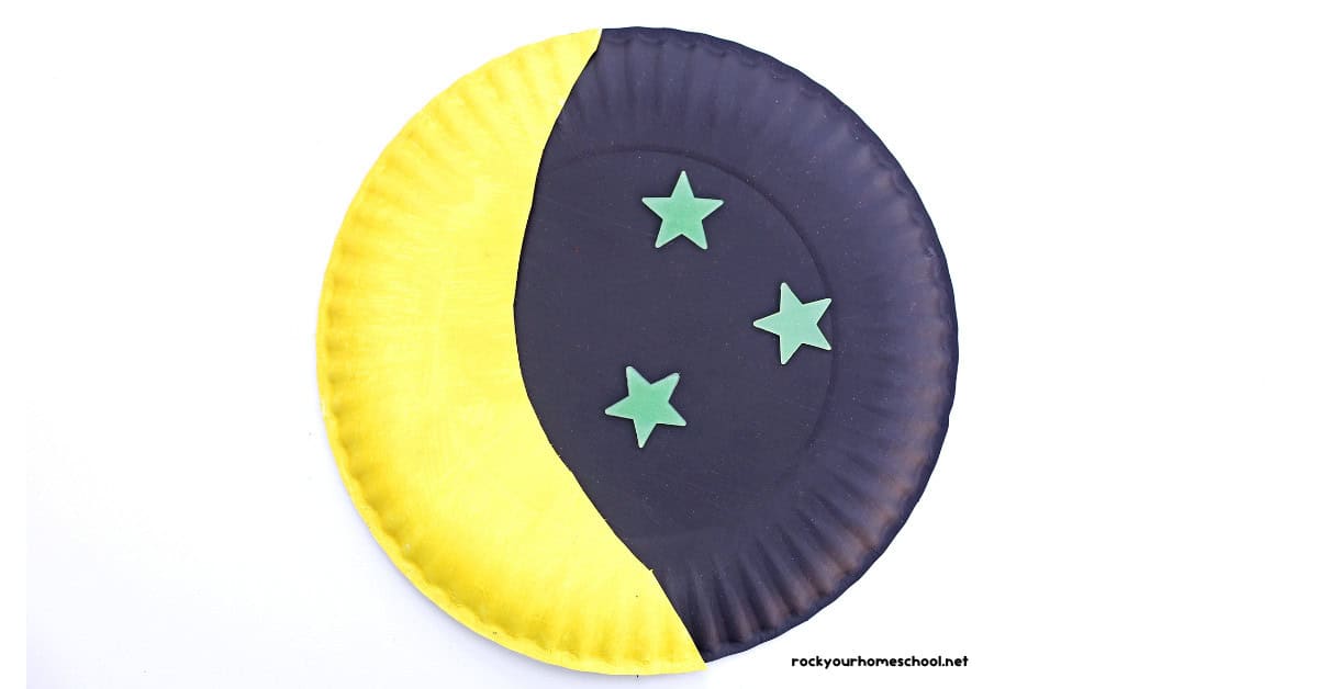 Example of paper plate moon craft with glow-in-the-dark star stickers.